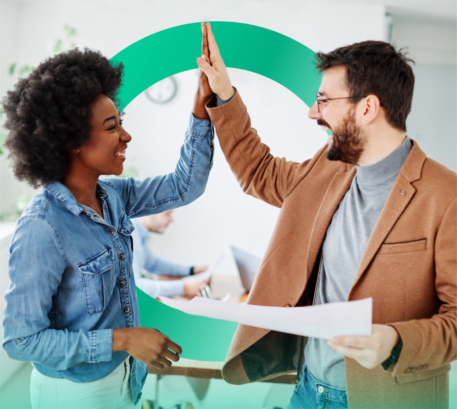 Two Cognition teammates high-fiving in front of a green Cognition ring backdrop.
